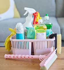 Image showing Cleaning service, product basket cleaner on living room table with home, house or lounge advertising and marketing career job. Liquid, detergent and dish water in plastic spray bottle for lounge room