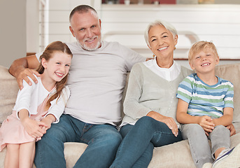 Image showing Grandparents, grandkids and being happy to relax and smile together on sofa in living room. Portrait, grandfather and grandmother with grandchildren for love, bonding and happiness on couch as family