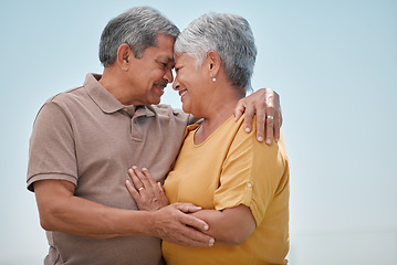 Image showing Senior couple, hug and love in care for marriage, relationship and romance in quality bonding time together in the outdoors. Happy elderly married man and woman with smile embracing retirement trip