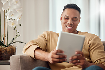 Image showing Tablet, sofa and black man relax with website information, subscription service or surfing social media app in home living room. Happy man with home technology reading ebook on a digital application