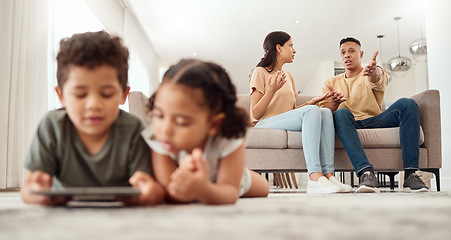 Image showing Mother, father and disagreement on living room sofa while children are playing with tablet on the floor at home. Mama and dad fighting, argue or conflict in difficult situation on couch in dispute