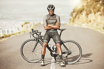 Image showing Black man, cycling and mountain bike with arms crossed for sports exercise, training and fitness in nature. Portrait of a confident African American male professional on a bike cycle tour outdoors