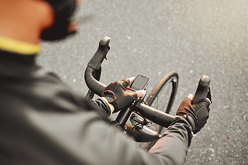 Image showing Cycling, fitness and sport technology ride tracker of a cyclist on a bike after road training. Training, bicycle exercise time and bike workout of a person doing healthy cardio and sports health