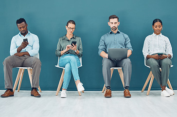 Image showing Business people, hiring and tech with some on mobile, laptop or tablet. Group of corporate workers, group or employee team on technology, computer or phone sitting and waiting for a job interview