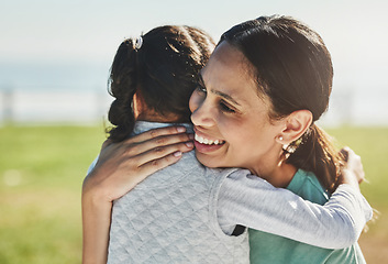 Image showing Happy, girl and kid hug mom at park for mothers day, love and relax outdoor for fun together in Colombia. Smile parent, laughing and child play with happiness, quality time and care in summer garden