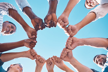 Image showing Fist bump, teamwork and business people in a team building meeting for collaboration, motivation and support. Global, below view and workers hands in a huddle startup for goals, targets and mission