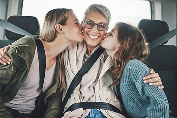 Image showing Family, children and road trip with a girl, mother and grandmother kissing in the backset of a car. Mothers day, travel and transport with a senior woman, daughter and grandchild in a vehicle