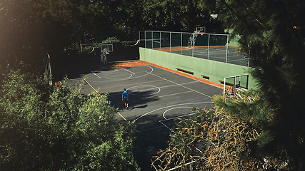 Image showing Drone, aerial view of basketball court and basketball player man preparing for training match, game or competition. Sports court, practice and workout or exercise preparation outdoors from above.