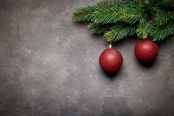 Image showing fir tree branch with red baubles