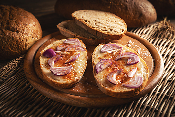 Image showing Slices of bread greased with lard