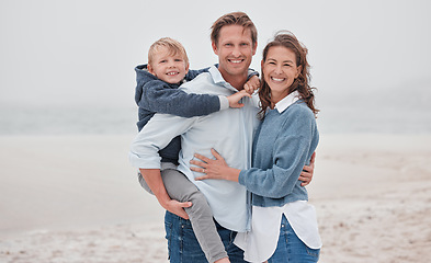 Image showing Family, beach and piggy back for child in portrait, happy and smile on vacation, holiday and relax. Kid, mom and dad with happiness, bonding or nature for ocean, sea and travel for adventure together