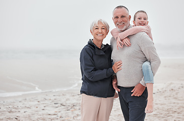 Image showing Family, beach and children with grandmother, grandfather and boy on the sand by the sea during summer vacation. Travel, kids and retirement with a male child, man and woman enjoying an ocean holiday