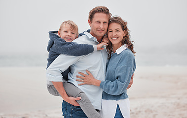 Image showing Family beach, child travel and parents smile on holiday by the tropical water on island in South Africa during autumn. Portrait of a happy mother, father and boy with love on vacation by the ocean