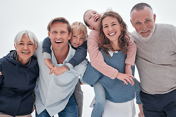 Image showing Family, happy and kids hug with funny quality time with a smile and elderly people. Portrait of senior grandparents, parents and children laughing with happiness, love and care together smiling