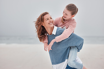 Image showing Mother, child and piggyback for love on beach with smile for quality bonding time together in nature. Mama and kid smiling in joyful happiness for back ride embracing relationship on sandy ocean walk