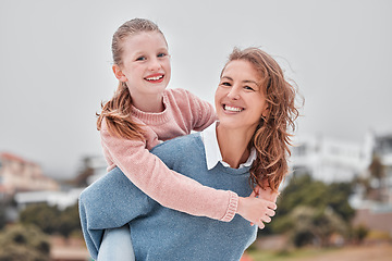 Image showing Mother, child and piggy back on beach on summer holiday smile in Greece. Portrait of woman with girl at the holiday with mom, happy kid and vacation with family love, freedom and fun in a town