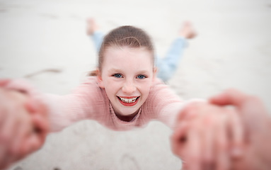 Image showing Child swinging from hands at beach, pov and happy, smile and laugh. Fun time, motion or girl in garden spinning from arms, support from dad in nature. Kid, sand and swing from hand in field in Sweden