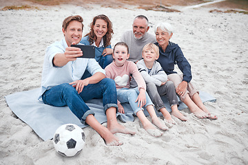 Image showing Big family, phone selfie and beach holiday, vacation or trip outdoors. Grandparents, parents and children with soccer ball on sandy seashore, bonding and taking photo for happy memory or social media