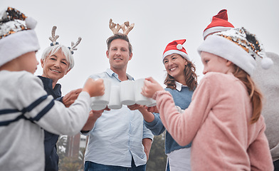 Image showing Christmas, celebrate and happy family on holiday travel vacation bonding together with drinks. Grandparents, parents and kid celebrating, quality time December festive drinking hot chocolate outdoors