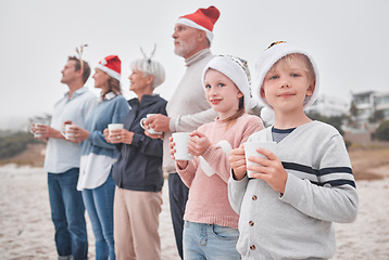 Image showing Love, Christmas and freedom for happy family at the beach drinking eggnog, coffee or tea on big family vacation. Festive quality time for grandparents, parents and kids bonding on Amsterdam holiday