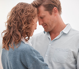 Image showing Happy couple, love and commitment while outdoor in nature sharing a romantic moment and smile. Safe, secure and happy man and woman showing appreciation, bond and connection in romance relationship