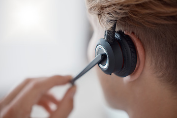 Image showing Closeup, headset in call center with woman, consultant or telemarketing in office. Contact us, crm or consulting in customer service, help or customer support with zoom of microphone for call