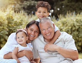 Image showing Family, children and happy grandparents bonding together outdoor with a baby and smile in nature. Portrait of kids, elderly people and young girl from Spain with happiness and quality time in a park