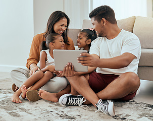 Image showing Family in living room, children smile with tablet video call online or streaming movies in Indonesia home. Indian mother sitting on floor, kids watch content on digital technology and happy father