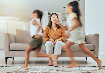 Image showing Child care stress, mother and children running with energy with mom feeling anxiety on a home sofa. Mama burnout, kids and fast siblings run in the living room lounge with tired mom on the couch