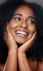 Image showing Black woman, makeup and beauty in closeup, face and smile with hands, cosmetic and happiness. Model, happy and skincare with cosmetics, shine or glow on skin for dermatology, wellness or health