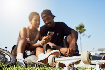 Image showing Couple, phone or bonding in skateboard park, nature garden or grass field on internet search, trick tutorial or stunt learning. Smile, happy or skateboarder man and black woman with mobile technology