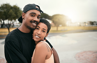 Image showing Skate, love and portrait of black couple hug in city enjoying weekend, free time and summer. Skating, trendy fashion and young black man and woman in relationship, dating and embrace in skate park