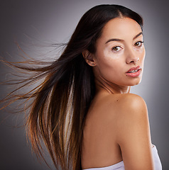 Image showing Beauty, skincare and portrait of woman with vitiligo standing in studio with health facial routine. Cosmetic, natural and face of girl model from Mexico with piebald skin isolated by gray background.