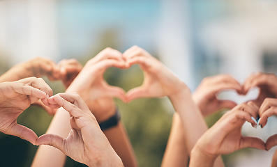 Image showing Crowd, hands and heart sign with group of people, community and friends with emoji for care, freedom and health outdoor. Fans, concert and support of men and women on solidarity for charity thank you