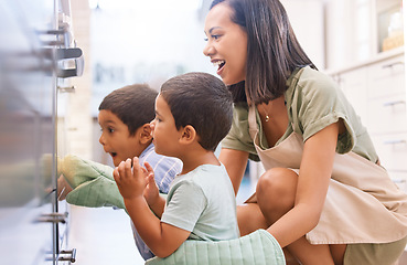 Image showing Wow, mother and children cooking in the oven in their kitchen together in their house. Surprise, shock and happy kids waiting for food, lunch or dinner with their excited mom in their family home