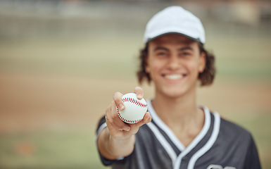 Image showing Baseball player, hand and baseball for holding, outdoor or sport on field, happy or summer for fitness. Man, sports and ball for pitch, play or game in softball, contest or event has smile on grass