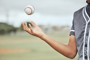 Image showing Baseball, hand and athlete holding a ball on an outdoor field for a match or sports training. Softball, sport and man playing with equipment for exercise before a game or practice on pitch at stadium