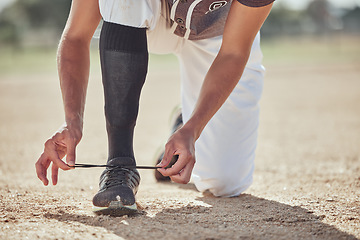Image showing Baseball, sports and athlete tie laces of shoes to prepare for a match or training on an outdoor field. Softball, sneakers and active man getting ready for a game or practice on a sport pitch.