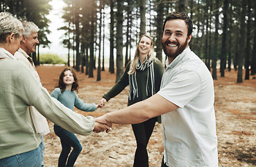 Image showing Happy family, hands and dance in forest with girl, parents and grandparents dancing in a circle in nature. Family, kids and holding hands with cheerful excited and laughing people in a park together