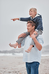 Image showing Father, child and piggyback pointing on the beach for walking, bonding and quality time together in the outdoors. Dad, kid and shoulder ride by the ocean for fun walk with smile in happiness outside