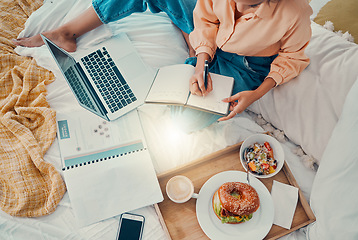 Image showing Marketing, laptop and woman writing with breakfast on her bed, working and planning information for strategy from above. Remote employee with business notes, food and report for creative work on a pc