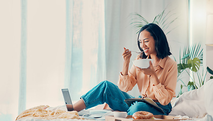 Image showing Breakfast, laptop and woman streaming a movie for lunch or brunch in a relaxing hotel suite bedroom on holiday. Smile and happy person enjoys laughing at comic shows or comedy films and eating food