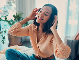 Image showing Headphones, relax music and happy woman on bed in home enjoying her favorite album. Freedom, smile and carefree female from Brazil having fun streaming audio, radio or podcast sound track on headset.