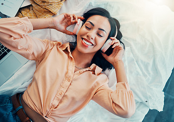 Image showing Woman with headphones, music or podcast, freedom and relax, carefree in her home, happy with technology and audio with top view. Young person, listening and streaming, radio and online subscription.