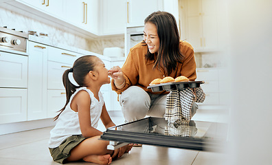 Image showing Cooking, cupcake and happy family of mother and child baking dessert food in oven and enjoy fun quality time together. Love, happiness and youth girl or kid bonding with mom, mama or woman in kitchen