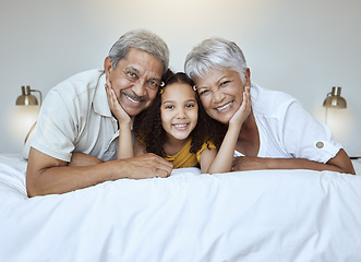 Image showing Girl, grandparents and smile on bed for portrait, together and bedroom for bonding, love and happy in home. Elderly, man and woman with child for happiness, embrace and care in room at family house