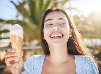 Image showing Ice cream, dessert and woman with smile on holiday in Miami during summer. Face of happy, excited and young girl eating sweet food or gelato on travel vacation in the urban city during spring