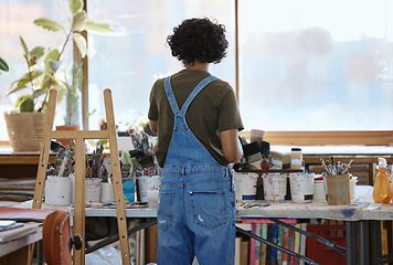 Image showing Woman, artist and painter in studio, creative workshop or Indian art gallery for abstract oil design. Thinking, planning or painting person with ideas for exhibition, expo or inspiration canvas class