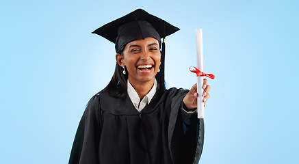 Image showing Graduation, certificate and girl in studio portrait for pride, success or achievement by blue background. Graduate woman, diploma or excited for award, celebration or paperwork for future at college