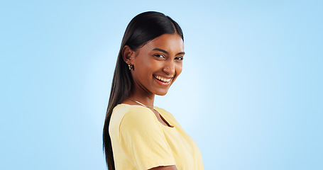 Image showing Portrait, smile and Indian woman with joy, fashion and happiness on a blue background. Profile, face and person with casual outfit, excited and model with mockup space, student and happy with joy